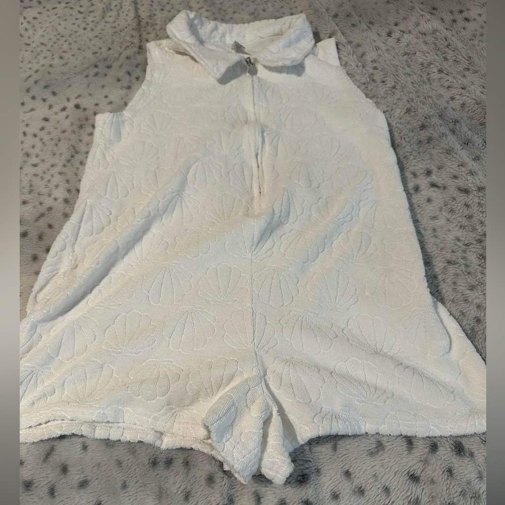 White Sleeveless Textured Romper with Shell Motif